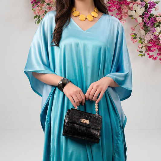 Diya Kaftan – close-up of the turquoise floral print