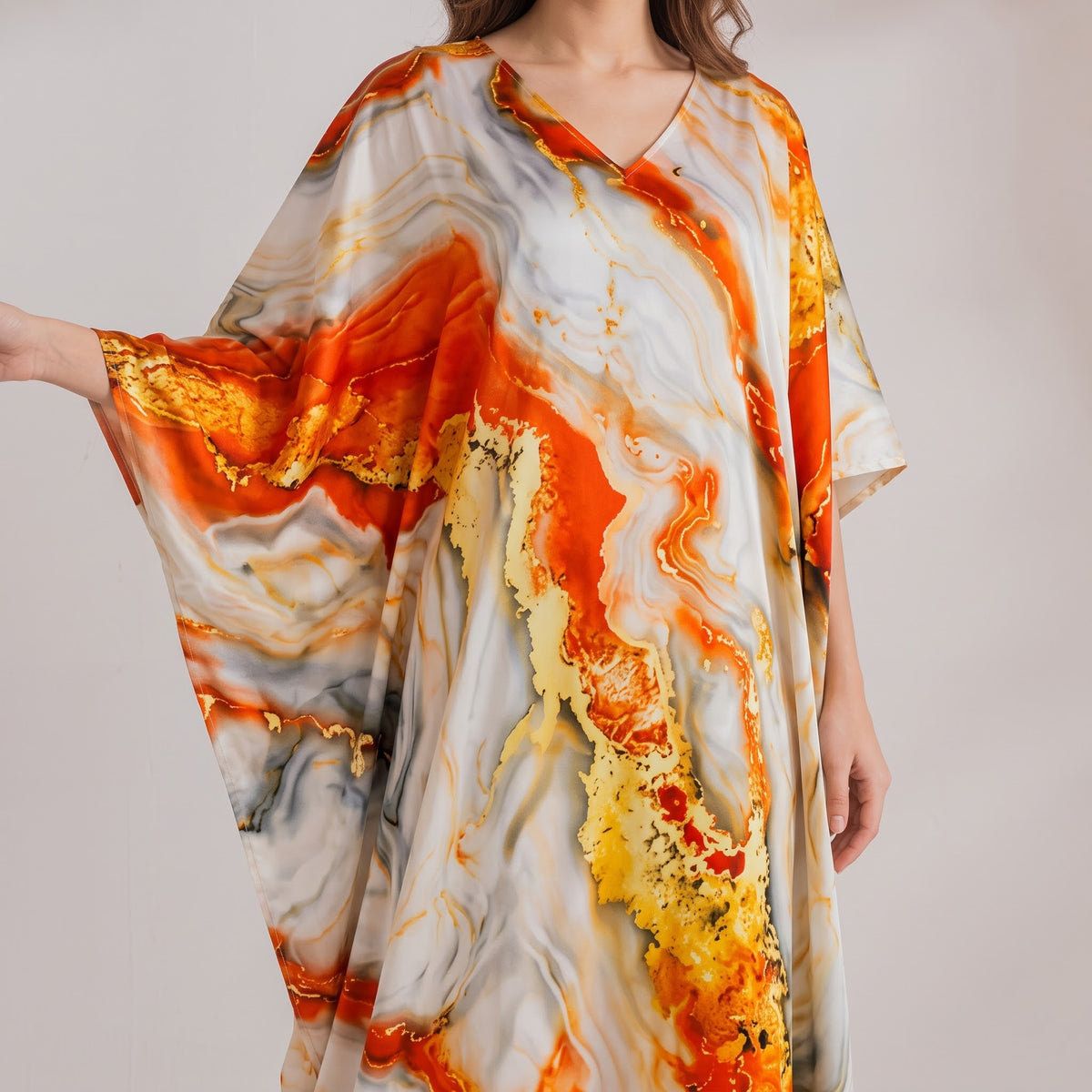 Elisa Kaftan – close-up of the rust orange floral print